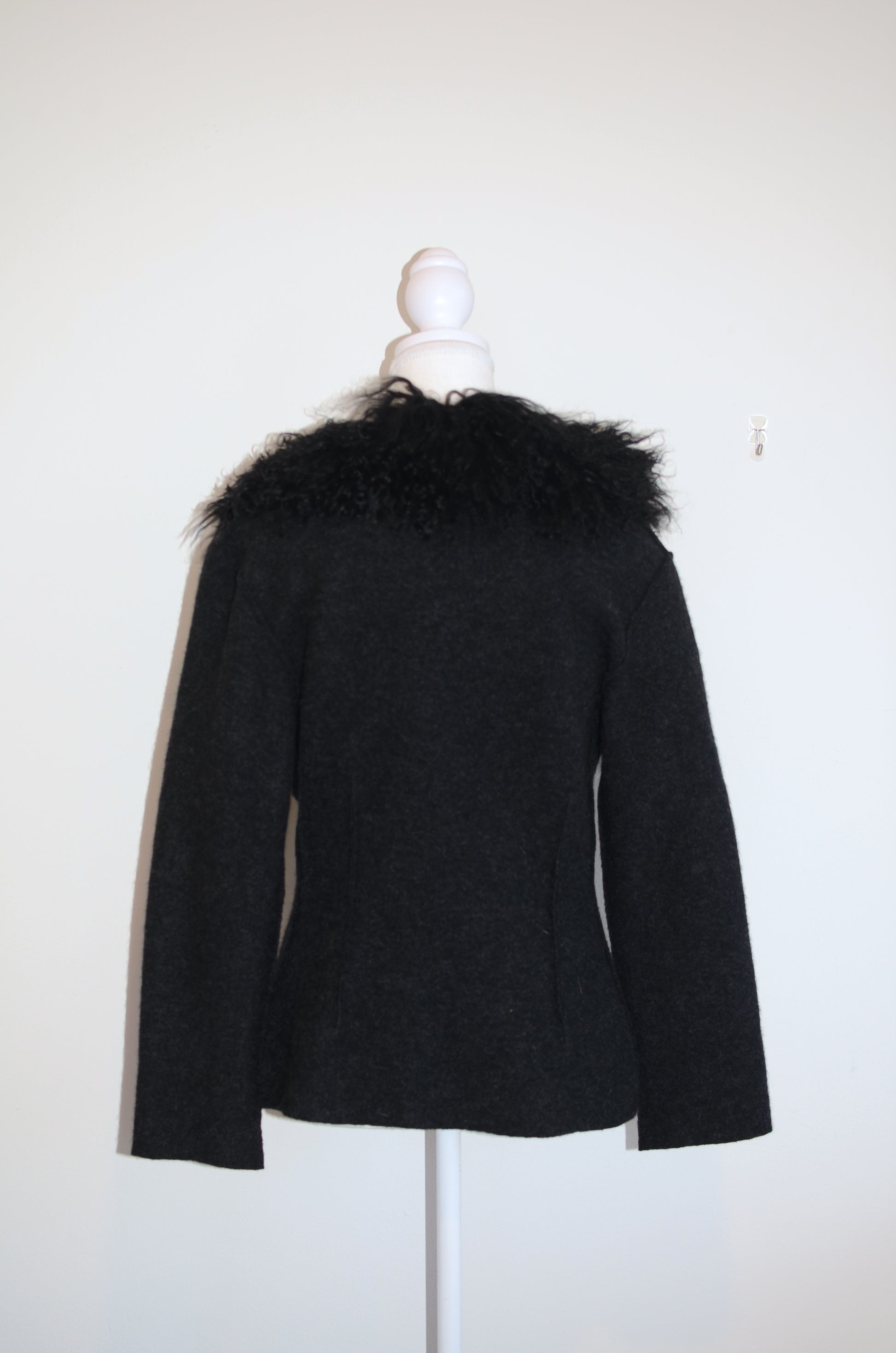 black of black Roberto Cavalli jacket with faux fur  trim on a mannequin against a white background